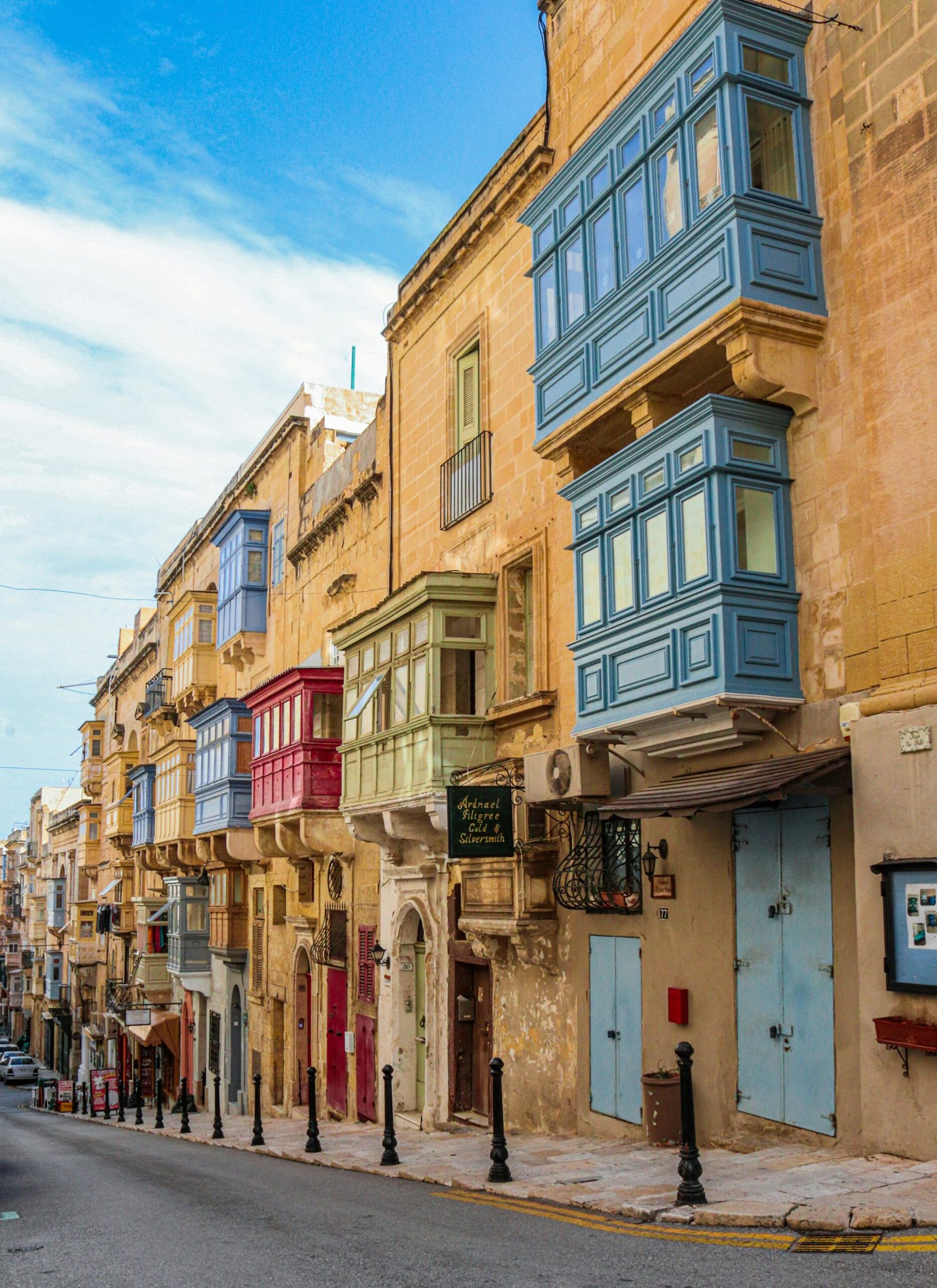 a row of buildings on the side of a street